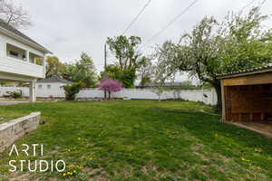 View of yard featuring fence