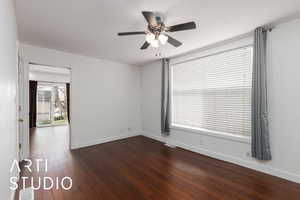 Unfurnished room with visible vents, baseboards, ceiling fan, and dark wood-type flooring