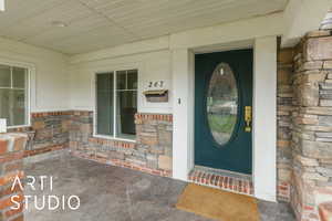 Property entrance with stone siding