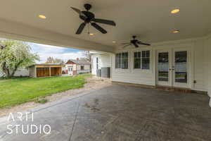 View of patio / terrace featuring central AC unit, a ceiling fan, french doors, and an outbuilding