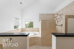 Full bath with walk in shower, a garden tub, visible vents, and vaulted ceiling