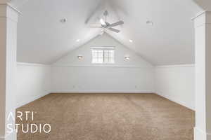 Bonus room with carpet, baseboards, a ceiling fan, and lofted ceiling