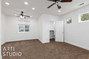 Unfurnished bedroom with carpet flooring, baseboards, visible vents, and recessed lighting