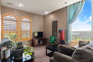 Living room featuring carpet flooring, valley views and baseboards
