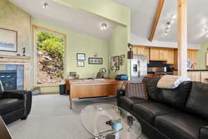 Great room featuring light colored carpet and a premium fireplace