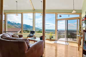 Great room with Hickory hardwood floors and a mountain view
