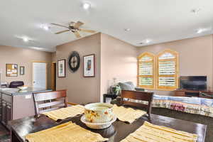 Dining area with a ceiling fan and recessed lighting