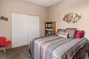 Bedroom with carpet floors and a closet