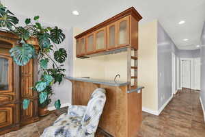 Interior space with baseboards and recessed lighting