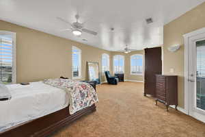 Bedroom featuring light colored carpet, baseboards, and visible vents