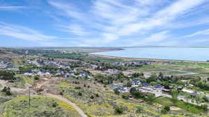 Drone / aerial view featuring a water view and a residential view