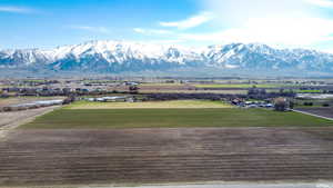 View of mountain backdrop with rural landscape