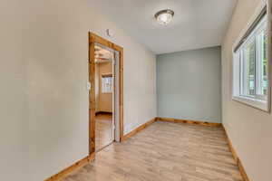 2nd bedroom/office with LVP floors and  wood baseboards