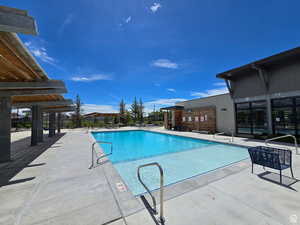 Community pool featuring a patio