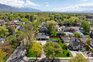 Aerial perspective of suburban area with a mountain backdrop