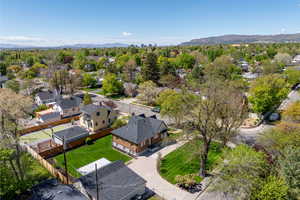Aerial view of residential area featuring a mountainous background