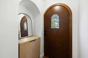Foyer entrance featuring arched walkways
