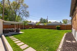 View of yard with an outdoor living space and a patio