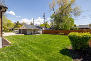 View of yard featuring a detached garage