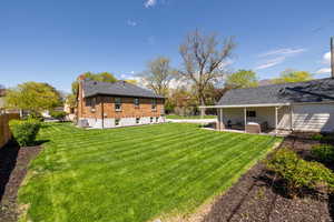 View of yard with an outdoor living space, a patio area, and cooling unit