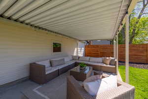 View of patio / terrace with an outdoor hangout area and fence