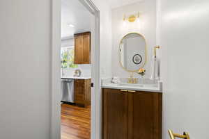 Bathroom with wood finished floors and vanity