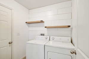 Laundry area with washing machine and clothes dryer
