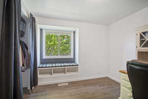Office featuring wood finished floors and baseboards