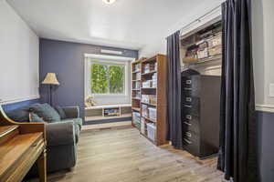 Living area featuring light wood-style floors