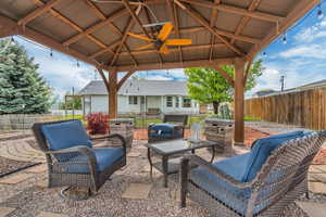 View of patio with a gazebo and a fenced backyard