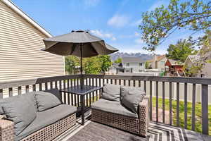 Trex deck with a residential view, a mountain view, and Vinyl fence