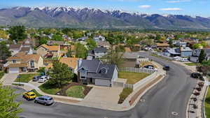 Aerial perspective of suburban area with a mountainous background