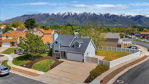 Aerial view of residential area featuring mountains