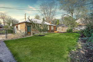 View of yard featuring a gate and a fenced backyard