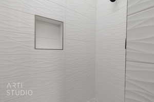 Bathroom featuring tiled shower