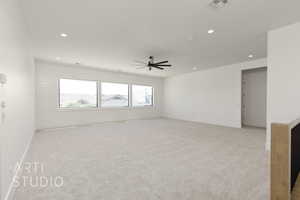 Empty room with light colored carpet, recessed lighting, ceiling fan, and baseboards