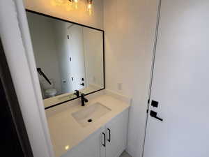 Bathroom featuring vanity and toilet