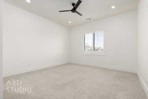 Carpeted empty room with a ceiling fan, recessed lighting, and baseboards