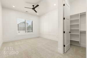 Unfurnished bedroom with light carpet, baseboards, recessed lighting, and a ceiling fan