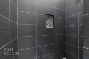 Bathroom view of a tile shower