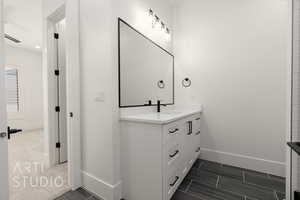 Bathroom with baseboards and vanity