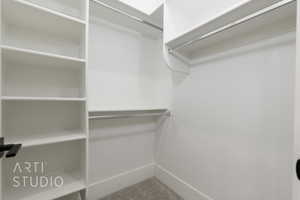Walk in closet with carpet