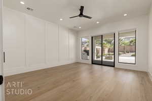 Unfurnished room with a decorative wall, light wood-type flooring, recessed lighting, and ceiling fan