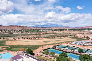 Aerial view of a mountainous background and a golf course
