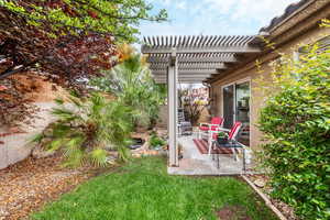 View of yard featuring a pergola and a patio area