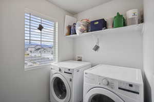 Laundry area featuring separate washer and dryer