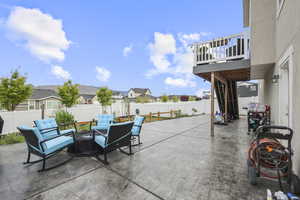 View of patio with a fenced backyard and a residential view