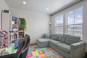Office space with wood finished floors, baseboards, and recessed lighting