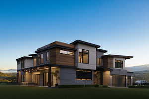 View of front of home featuring a mountain view and stucco siding