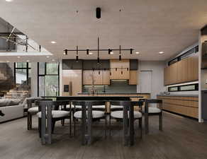 Dining area featuring wood finished floors, expansive windows, stairs, and recessed lighting